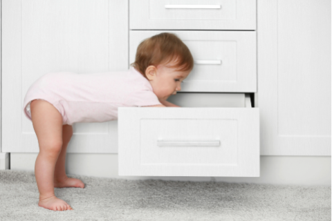 Kid reaching in drawer